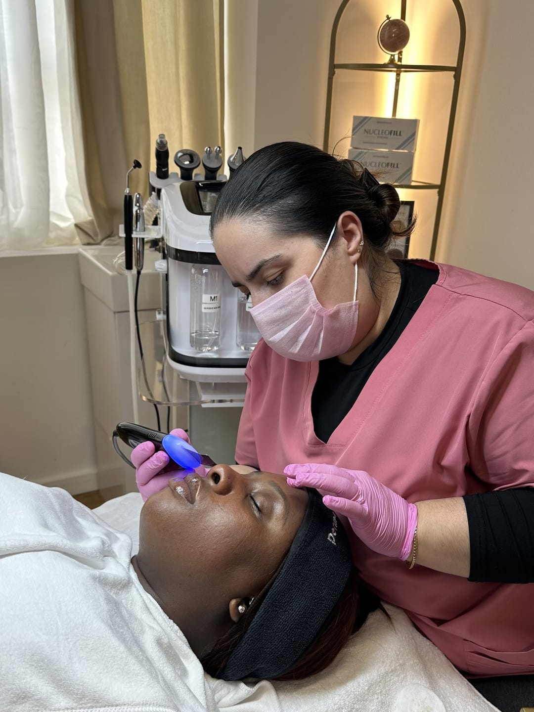Catia delivering a HydroMED Pro 9-in-1 medical facial at Melatone Skin Clinic Battersea