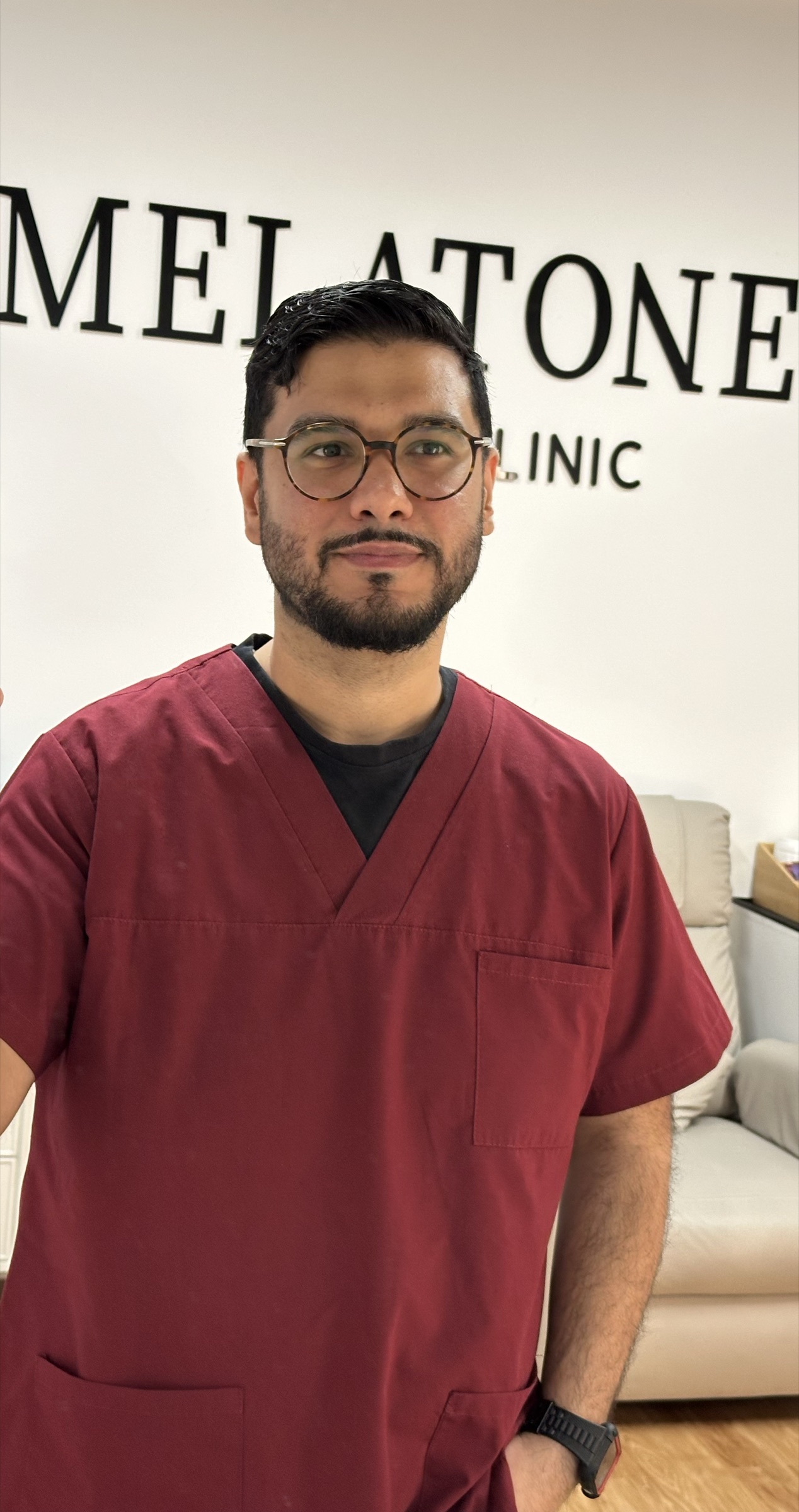 Arman Zaki, Founder of Melatone Skin Clinic and GMC-registered Physician Associate, a Skin of Colour clinician, in clinic at Battersea